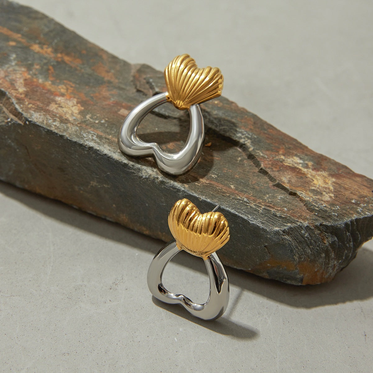 Two-tone heart stud earrings