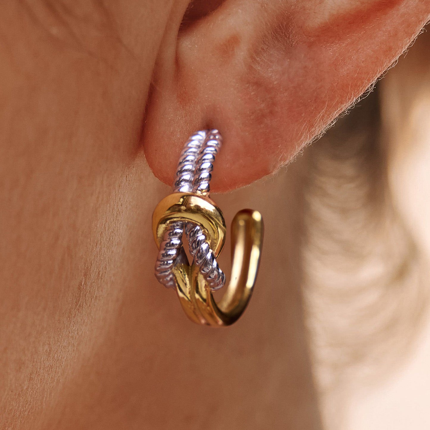 Knot shaped titanium steel earrings