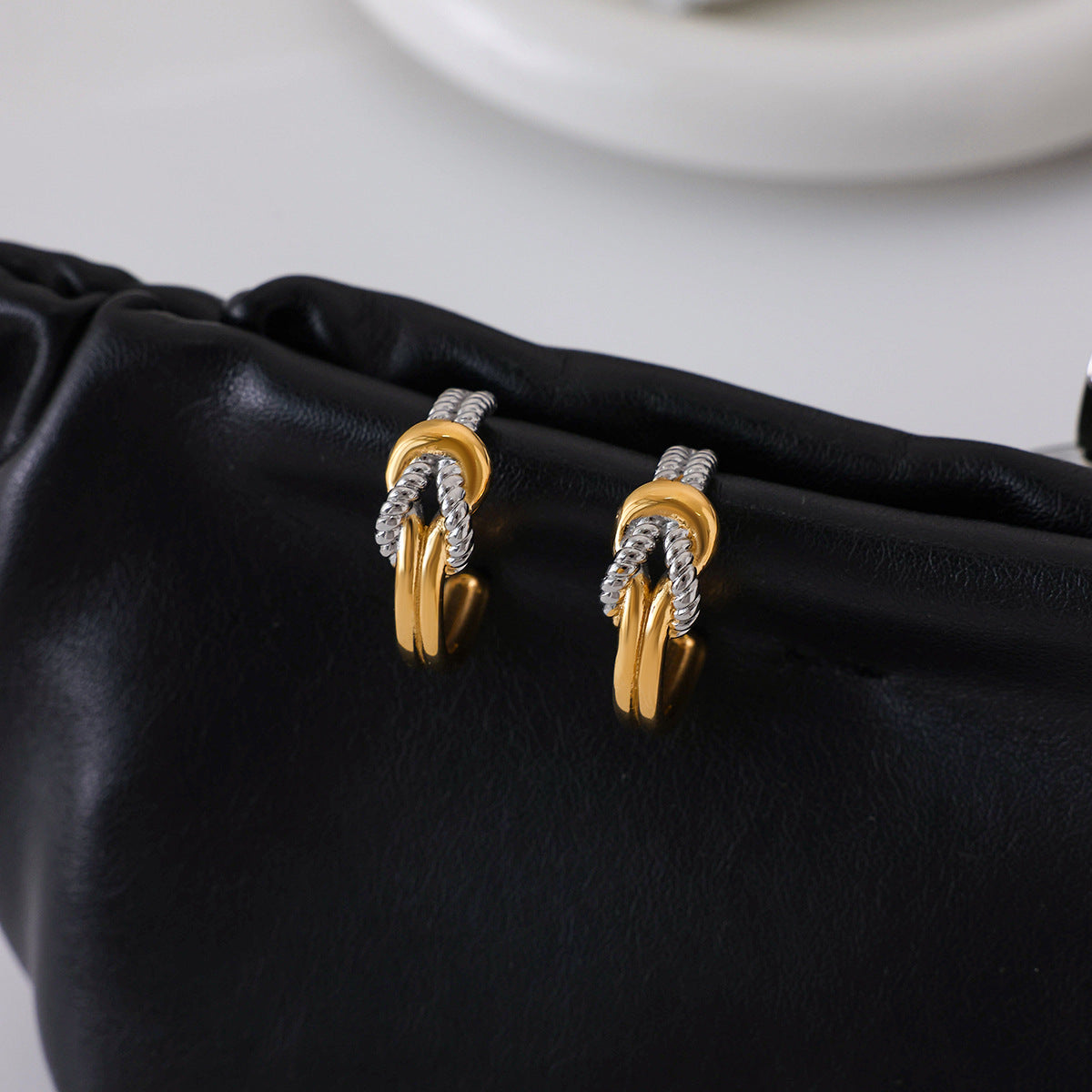 Knot shaped titanium steel earrings